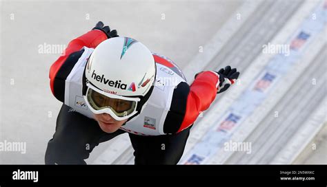 Switzerland S Simon Ammann Speeds Down The Hill During His Trial Jump