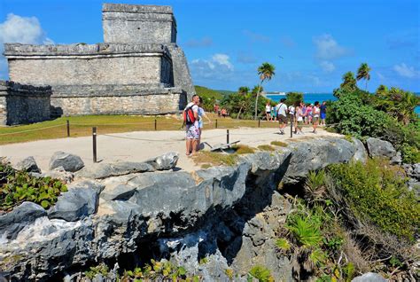 Tourists Exploring The Mayan Ruins In Tulum Mexico Encircle Photos