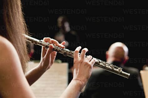 Flute Player In Orchestra Stock Photo