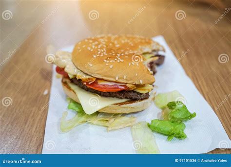 Bite Beef Burger On The Table In A Restaurant Stock Photo Image Of