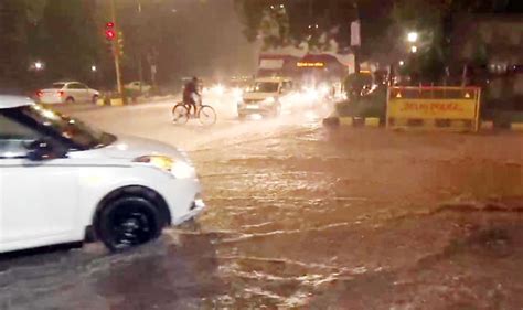 Heavy Rain Lashes Parts Of Delhi Ncr Brings Respite From Acute