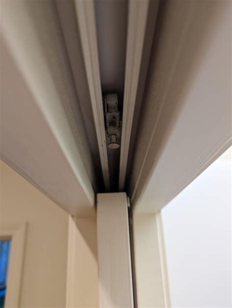 Laundry room pocket door. Sliding fastener came out of the top of the