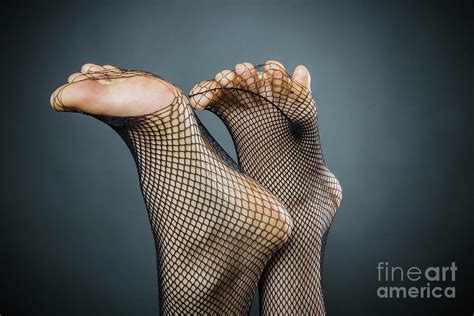 Womans Feet Poking Through Fishnet Photograph By Sven Hagolani Pixels