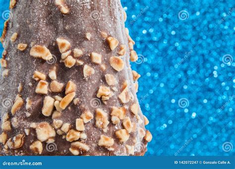 Ice Cream with Chocolate Coating and Pieces of Peanuts Stock Image ...