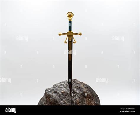 Excalibur The Mythical Sword In The Stone Of King Arthur Stock Photo