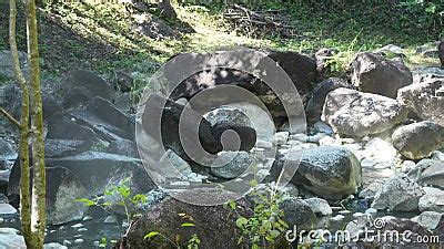 Mountain Hot Spring In True Nature With Lots Of Rock And Steam Warter In The Sun Day Stock