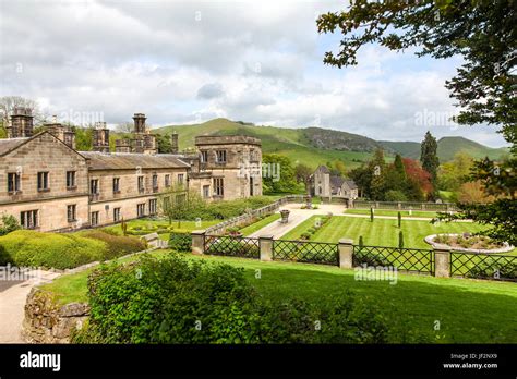 Ilam Hall And Gardens With Church Of The Holy Cross In The Background