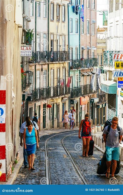 Tourists Exploring the Old Streets of Lisbon City in Portugal Editorial ...