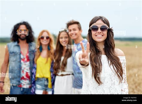 Happy Young Hippie Friends Showing Peace Outdoors Stock Photo Alamy