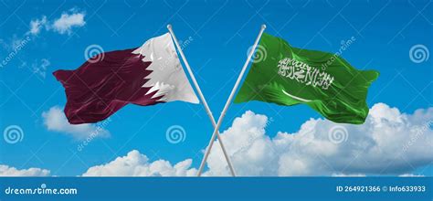 Two Crossed Flags Saudi Arabia And Qatar Waving In Wind At Cloudy Sky