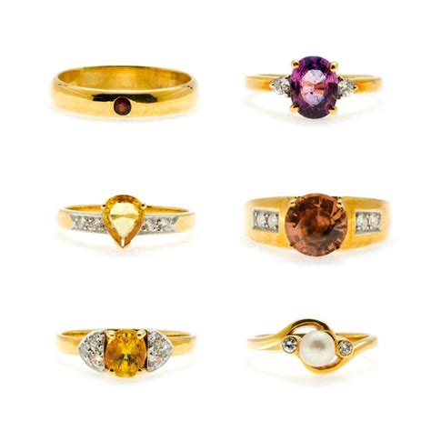 Premium Photo | Set of Gold wedding rings with gemstones isolated on ...