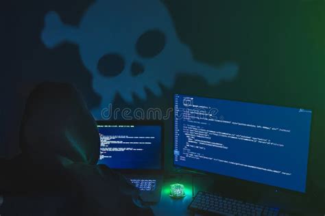 Computer Hacker Silhouette Of Hooded Man Using Laptop And Monitor For