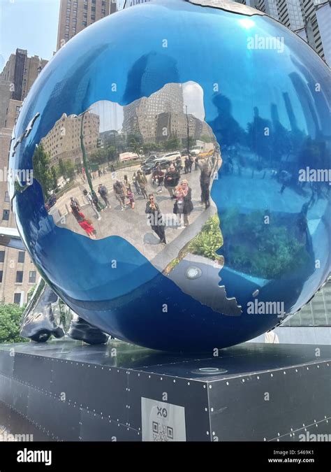 Giant Reflective Blue Ball Game Piece In Art Installation By Daniel