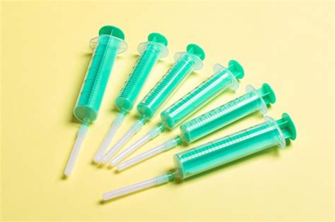 Premium Photo Top View Of Medical Syringes On Colorful Background