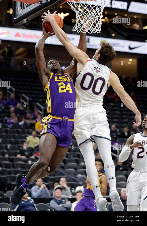 Saint Marys Tanner Krebs 00 Covers A Shot From Lsus Emmitt Williams