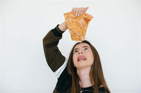 Premium Photo Young Beautiful Woman Eat Slice Of Pepperoni Pizza