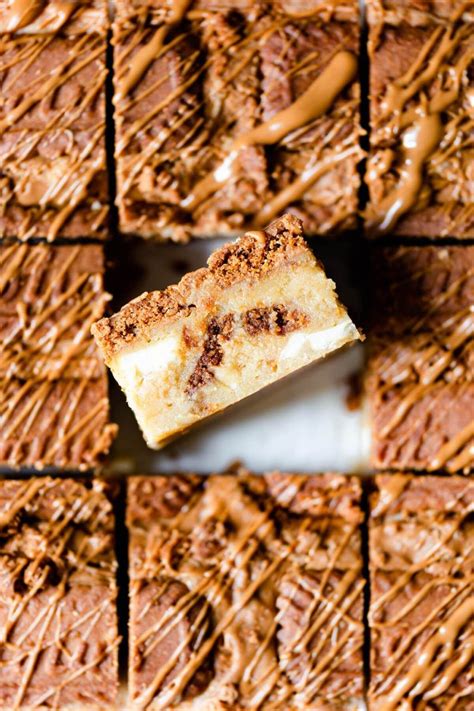 A Piece Of Cake Sitting On Top Of A Pan Covered In Frosted Brownies