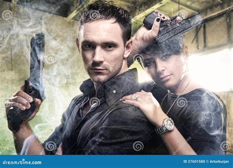 An Attractive Young Couple With Guns Stock Photo Image Of Armed