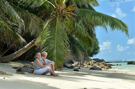 Premium Photo Portrait Of Elderly Couple Resting On Beach Travel