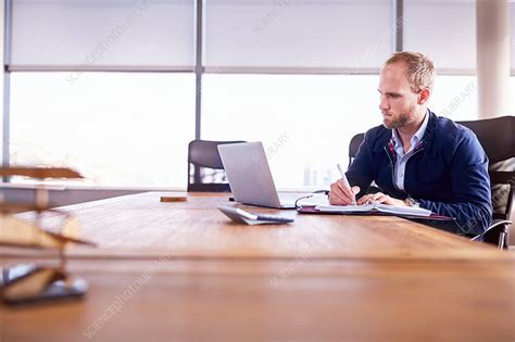 Focused Businessman Taking Notes At Laptop Stock Image F0180445