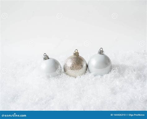 Three Round Christmas Balls In The Snow Merry Christmas Or Happy New