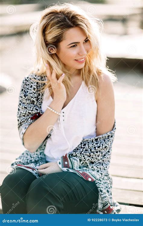 Blonde Girl On The Beach Of The Sandy Beach By The Sea Stock Image