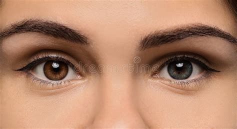 Woman With Beautiful Eyes Of Different Colors Closeup Heterochromia