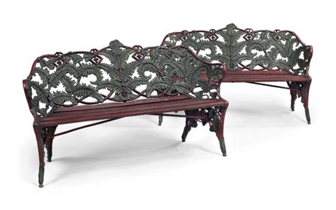 A PAIR OF FERN AND BLACKBERRY PATTERN CAST IRON GARDEN BENCHES ONE