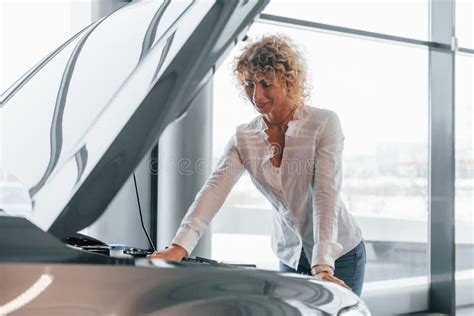 Vehicle Breakdown Woman With Curly Blonde Hair Is In Autosalon Stock Photo Image Of Brand