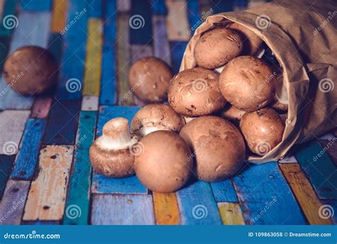 Little Brown Mushrooms In A Paper Bag Stock Photo Image Of Blue