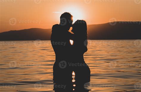 Silhouettes In Love Romantic Couple Lovers Hugging Kissing Touching