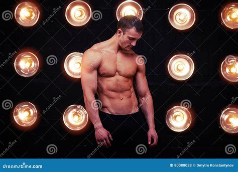 Ripped Muscular And Lean Body Of Male Model In Studio Lights Stock