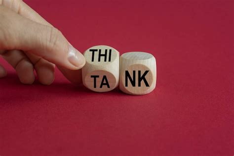 Premium Photo Think Tank Symbol Businessman Turns A Wooden Cube And