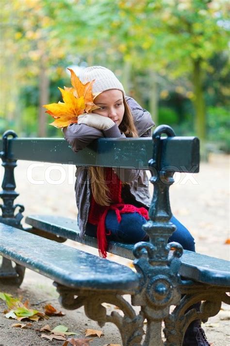 Sad Girl Sitting Alone On Bench