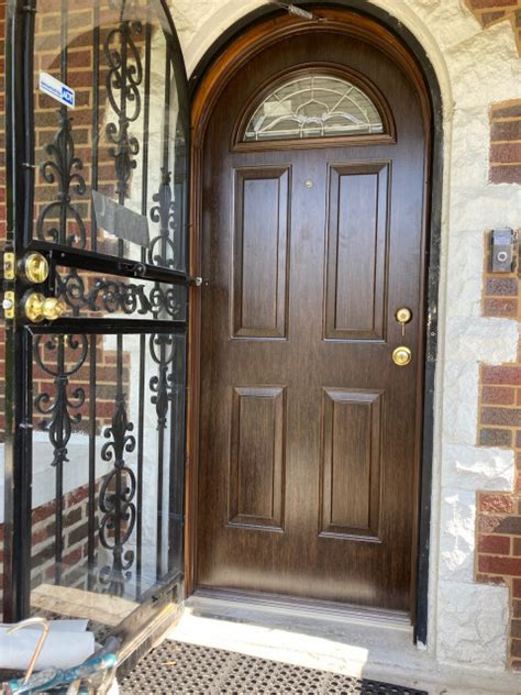 Woodgrain Round Top Steel Entry Door With Decorative Glass After