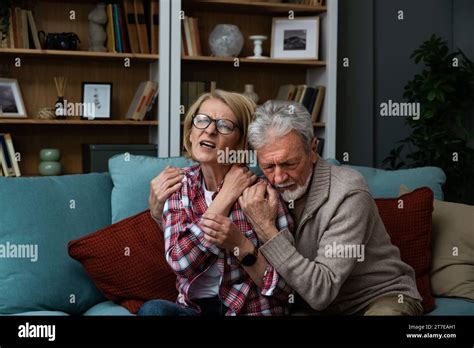 Senior Couple Elderly Man Husband Taking Care Comforting Her Sick Wife Massage Her And Hugging