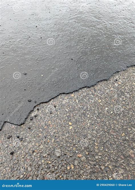 Access Road with Deteriorating Asphalt, Gravel, and Rainwater
