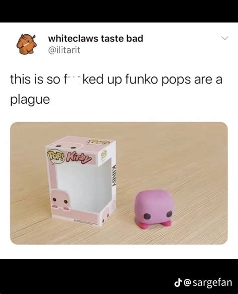 A Pink Toy Sitting Next To A White Box On Top Of A Wooden Table With