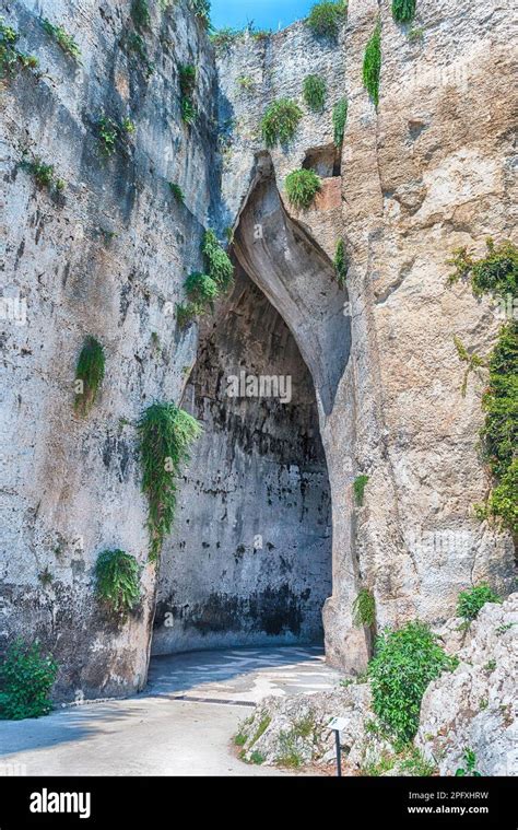 Entrance Of The Cave Named Ear Of Dionysius One Of The Main Landmarks