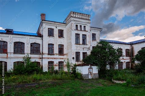 Old creepy abandoned haunted mental hospital overgrown by plants Stock ...