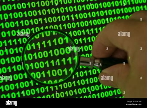 Binary Code Viewed Through A Magnifying Glass Stock Photo Alamy