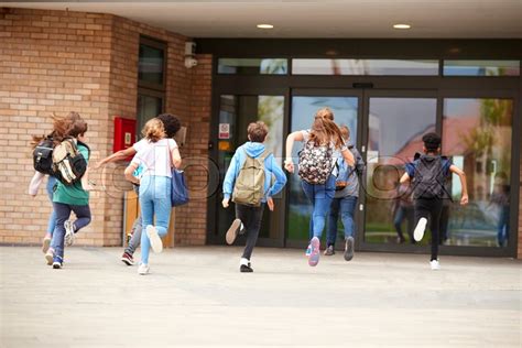 Group Of High School Students Running Stock Image Colourbox