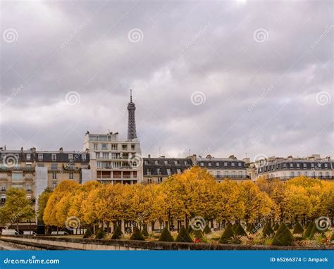 Autumn In Paris Town Homes Among Yellow Trees Background Eiffel Tower