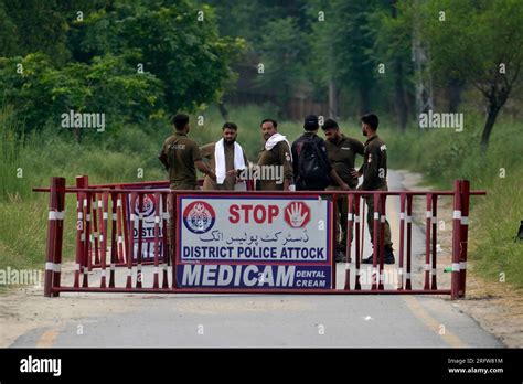 Police Officers Barricade A Road Leading To District Prison Attock