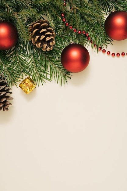 Christmas Decorations And Pine Cones On A White Background With Space