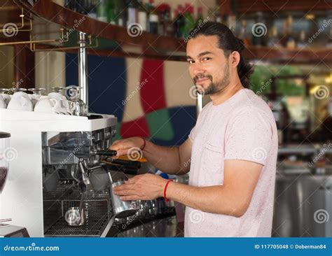 Handsome Young Smiling Male Barista Preparing Coffee Drink Using Stock