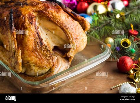 Christmas Turkey Marinated In Sauces Roasted In Oven With A Glass Baking Container On Table