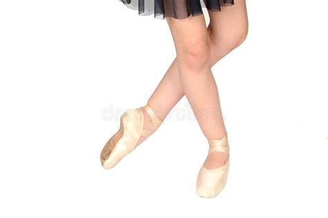 Ballerina Legs In Pointe Shoes Closeup On White Background Classic And