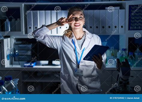 Beautiful Blonde Woman Working At Scientist Laboratory Late At Night