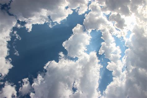 Free Stock Photo of Sun Shining Through Clouds in Sky